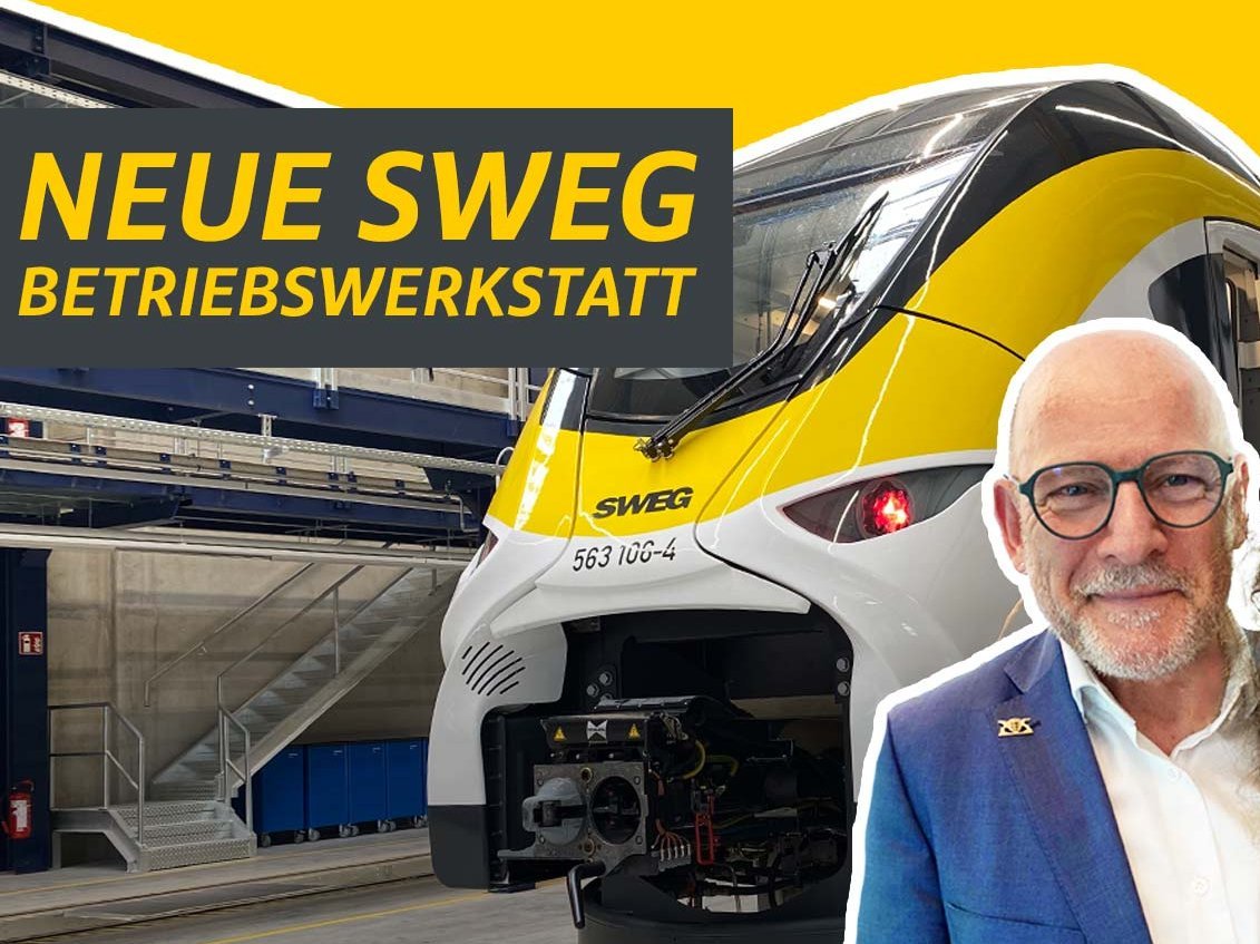 Bild eines Batteriezuges mit dem Verkehrsminister im Vordergrund.